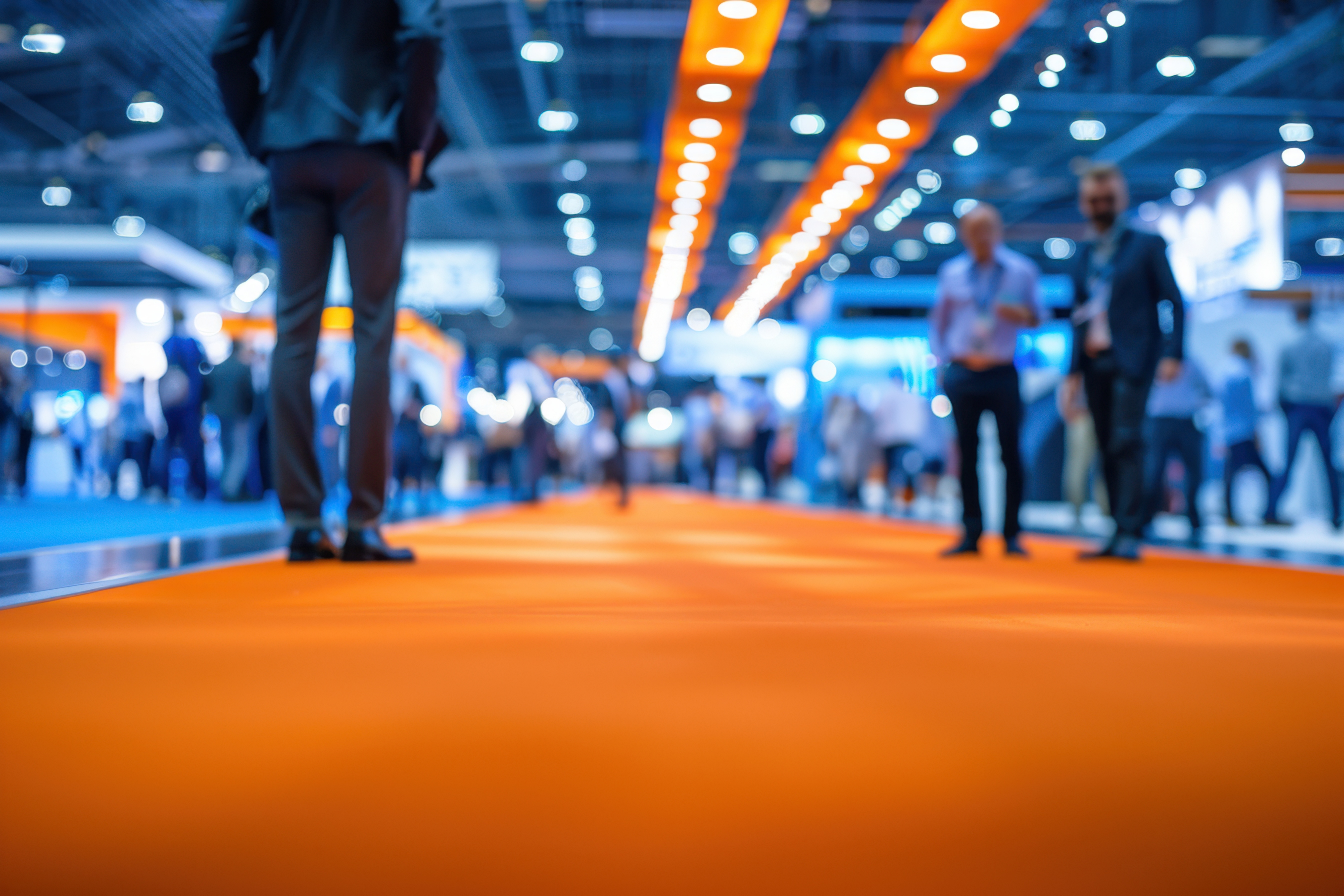 A blurred background of people walking around at an international business conference Generative AI